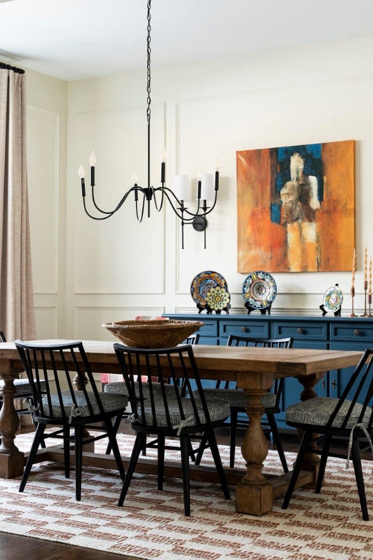 Stylish dining room with custom chandelier in whole home remodel