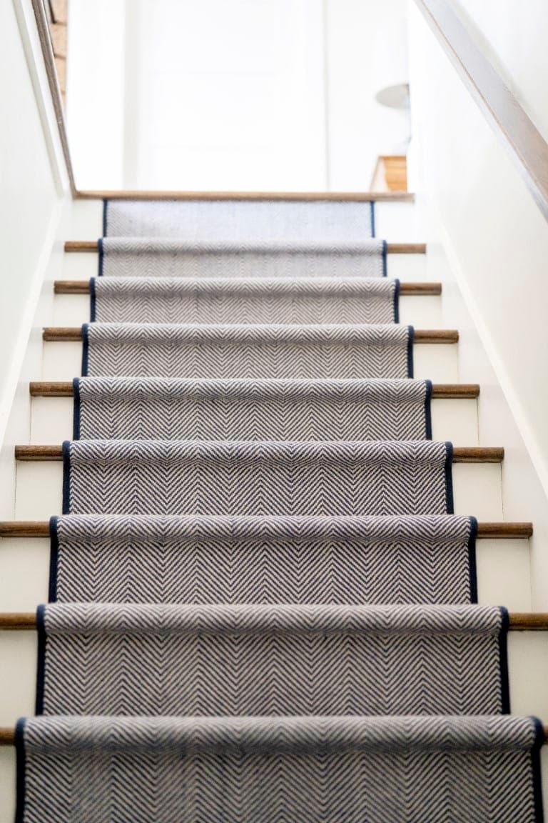 Refinished stairway with patterned runner in Preston Court remodel