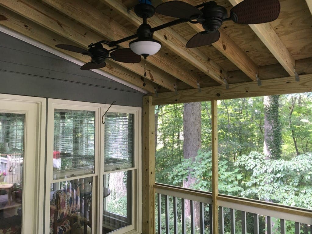 Covered porch addition with ceiling fan and mountain view